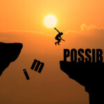 man jumping impossible possible cliff sunset background business concept idea